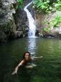 Swimming By The Waterfall Photo