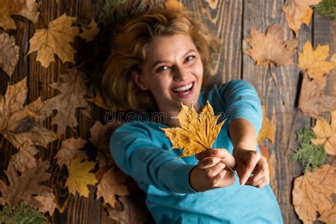 Autumn Leaves In Girl Hands Playing In Autumn Nature Happy Woman Lying On Fall Background