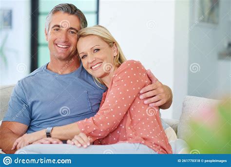 Laid Back Loving At Home Portrait Of A Loving Mature Couple Relaxing