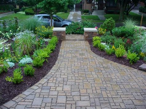A front yard or garden path can be its own work of art trailing through a simple grass lawn. Front walk landscaping. | Sidewalk landscaping, Front ...