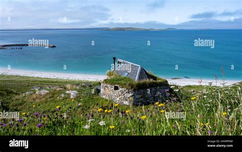 View Towards Eriskay Ferry Terminal With A House Built On The