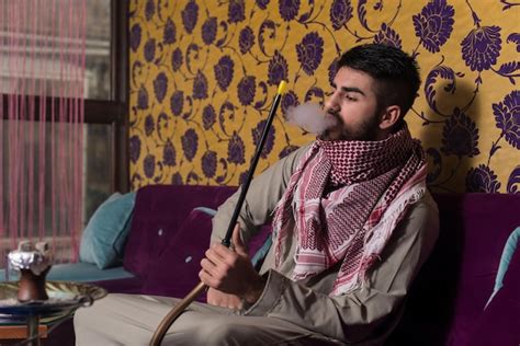 Premium Photo Arab Man Smoking Shisha And Drinking Coffee