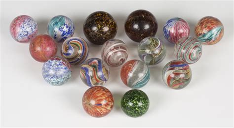 Seventeen Large Glass Marbles Including Mica Onion Pattern And