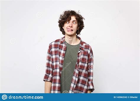 Portrait Of Crazy Loony Young Man In Casual Clothes With Beveled Eyes