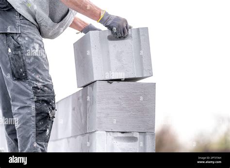 Construction Of A Wall Of A House Made Of Concrete Blocks Stock Photo