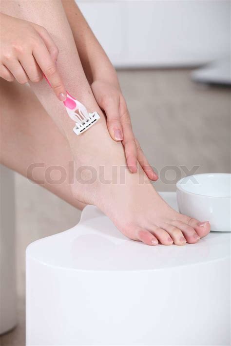 Woman Shaving Her Leg Stock Image Colourbox