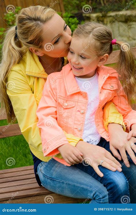 Happy Mother Hugs Her Daughter Outdoor Stock Photo Image Of Park