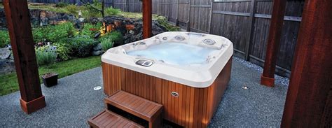 Whirlpool bathtubs can be an excellent addition to the restroom as they provide a relaxing bath for easing the tired the best whirlpool tubs have a combination of both and are surely worth the extra money! Jacuzzi hot tub with steps outside under arbor | Jacuzzi ...