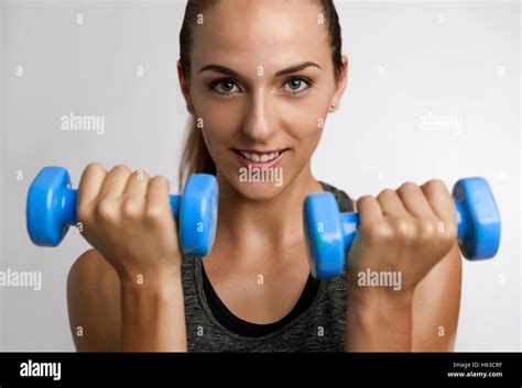 Young Fitness Woman Making Exercises With Dumbbells Stock Photo Alamy