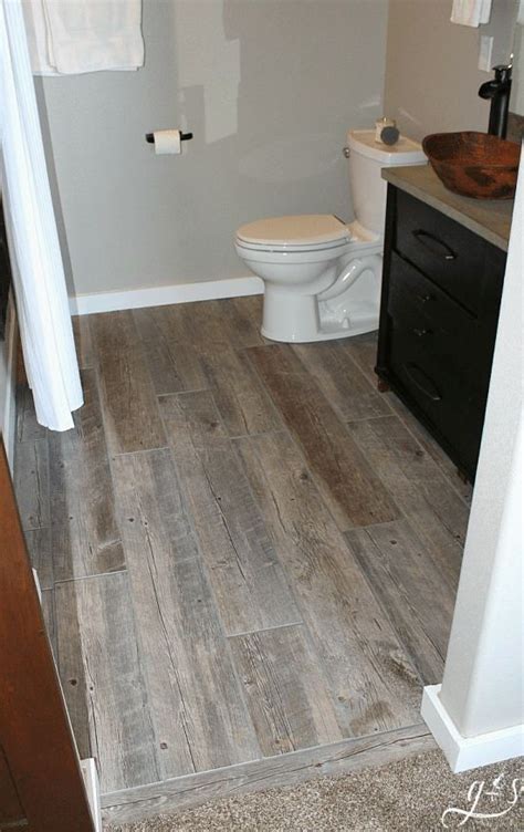Diy How To Lay Floor Tile Planks Our Master Suite Bathroom Floor Is