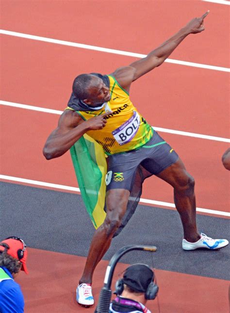 jamaica legend usain bolt flashes his signature pose a lightening bolt gold medal impressions