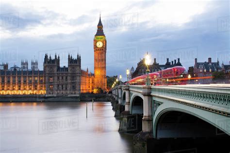 Westminster Bridge Over Thames River Against Big Ben During Sunset