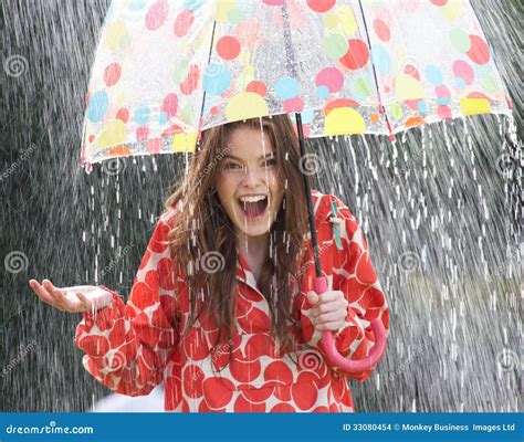 Teenage Girl Sheltering From Rain Beneath Umbrella Stock Photo Image