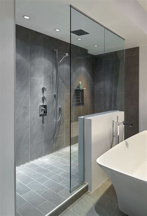 Large Walk In Doorless Shower With Gray Slate Tiles And A Floating Glass Wall Creates A Gorgeous