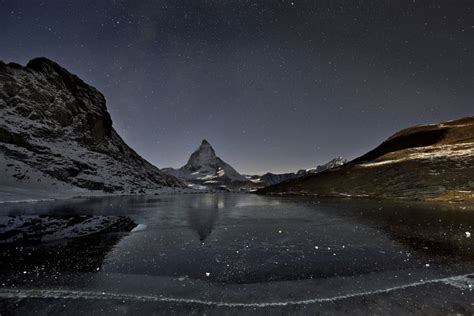 The Matterhorn Looms Above A Frozen Lake Gornergrat Zermatt