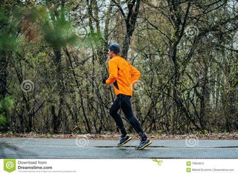 Man Running Down Road In Park Editorial Image Image Of Spring Path