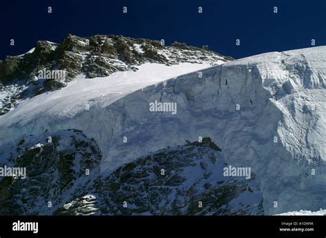 Summit Of Mt Gran Paradiso In Italy Alps And Huge Mountain Glacier Wall Summer Stock Photo
