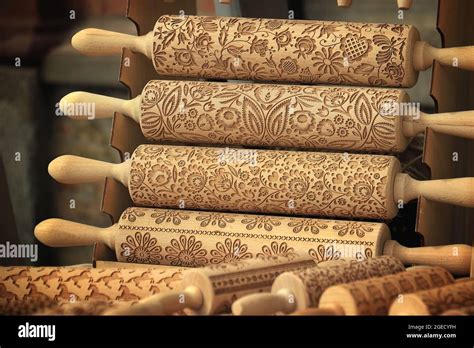 A Display Of Wooden Rolling Pins With Various Designs Stock Photo Alamy
