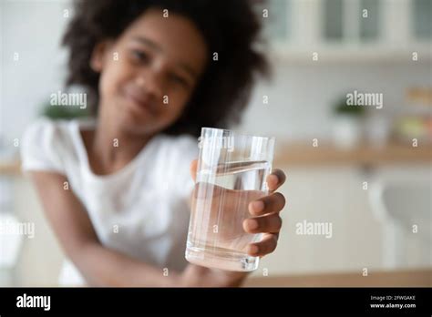 African American Child Drinking Water High Resolution Stock Photography