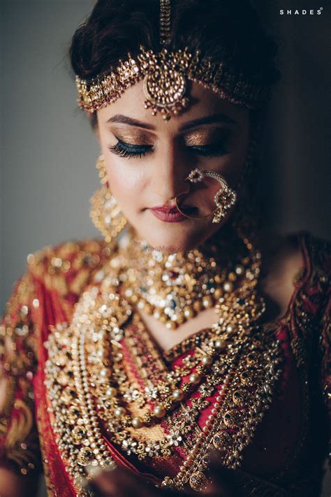 photo of a south indian bride in gold jewelry