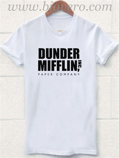 A White Coffee Mug With The Words Dunder Mifflin On It