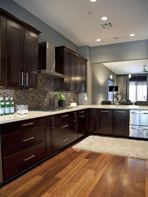 Gray kitchen cabinets are getting more and more popular among many homeowners, designers, and contractors in the us. Nice combination of dark wood cabinets and oak hardwood ...
