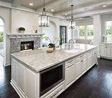 Though this kitchen's range and cabinets are both white, one has brass. Taupe White Granite Countertops in Kitchen | C&D Granite ...