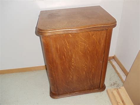 Maybe you would like to learn more about one of these? White treadle sewing machine in oak cabinet | Collectors ...