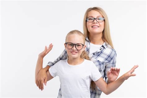 Premium Photo Portrait Of Mother And Daughter With Eyeglasses On White Background