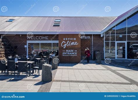 Tourists Relaxing At Restaurant Geysir Glima Against Blue Sky During