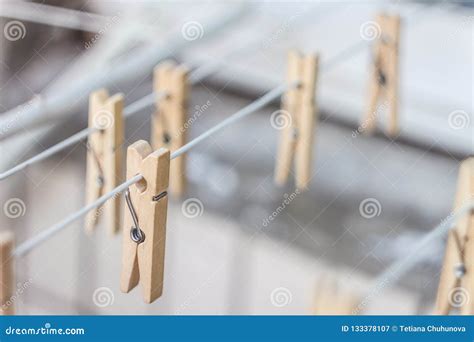 Wooden Clothespins On A Clothesline Blur Light Photo The Concept Of