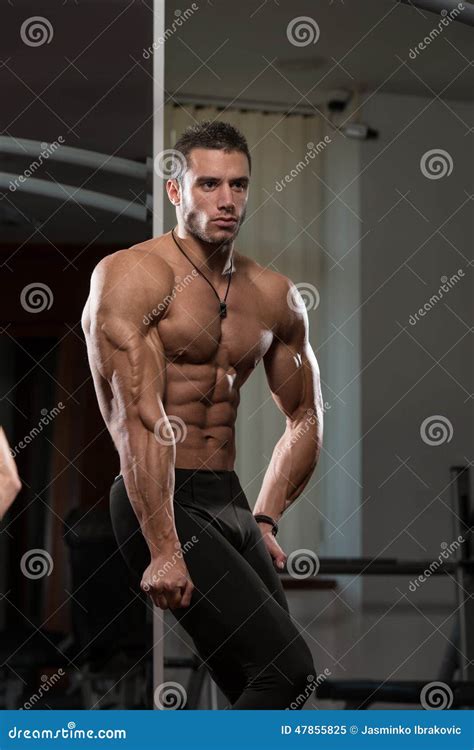 Young Man Performing Side Triceps Pose Stock Image Image Of Conscious