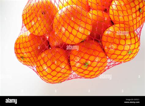 Orange Fruit In Net Bag Stock Photo Alamy