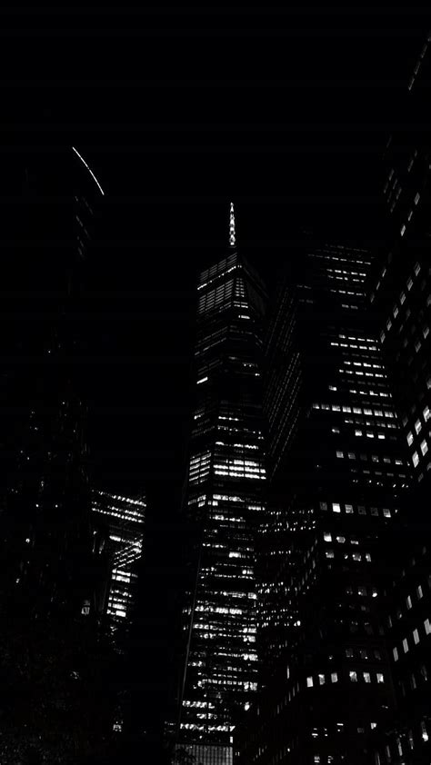 Download Dark Night View Of Tall Buildings Wallpaper