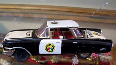 estate shop vintage toy badges and 1950 s cadillac tin toy police car