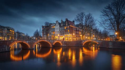 The netherlands ), informally holland,1415 is a country located in western europe with territories in the it is the largest of four constituent countries of the kingdom of the netherlands.161718 in. Man Made Amsterdam Cities Netherlands Night Water Reflection Urban HD Travel Wallpapers | HD ...