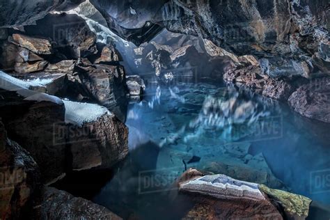 Grjotagja Cave Is A Small Natural Lava Cave With Blue Water Near Lake