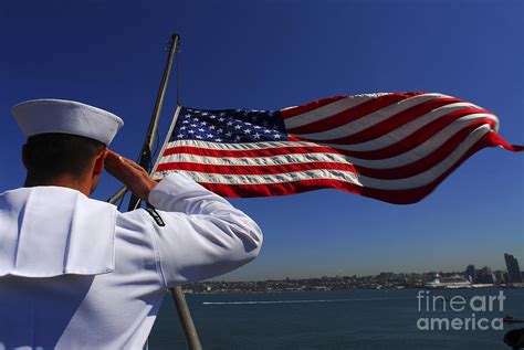 A Sailor Salutes The American Flag Photograph By Stocktrek Images