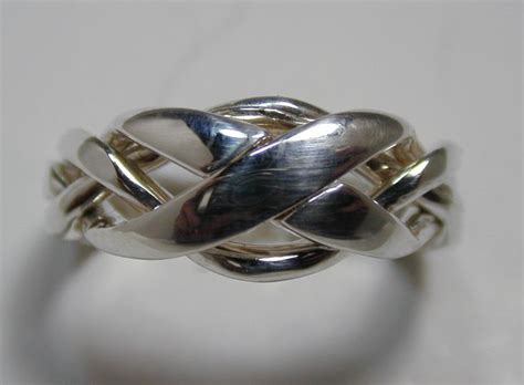 The most common is the 3 or 4 band puzzle ring. Ladies 4 Band Puzzle Ring 4NX | Etsy | Puzzle ring, Gothic ...