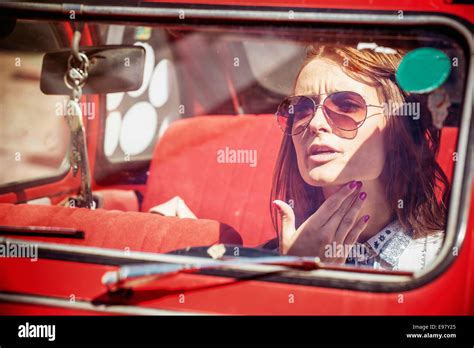 Portrait Of Young Woman With Sunglasses In Red Car Stock Photo Alamy