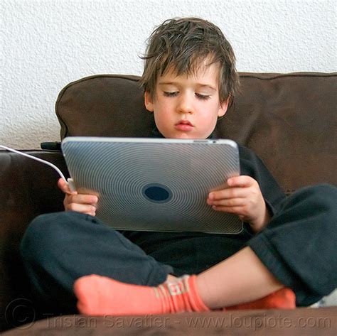 Kid Playing Video Game On Ipad