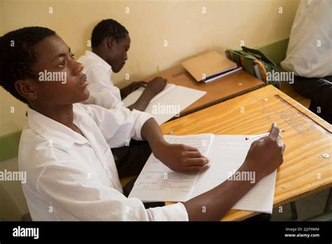 Secondary School Students Learning At Desks In Classroom In Oshana