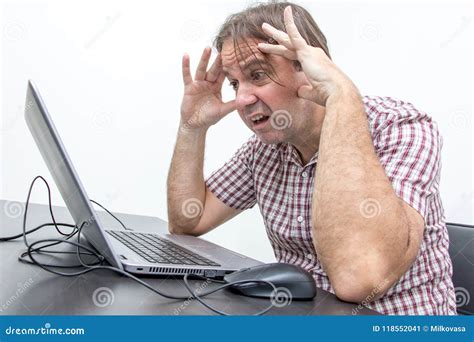 The Confused Unhappy User Is Looking At The Computer Stock Image
