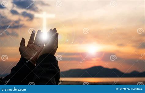 Christian Woman Praying Worship At Sunset Hands Folded In Prayer