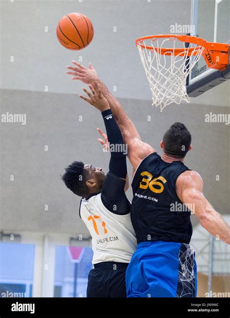 Basketball Players Going Up For A Rebound Stock Photo Alamy