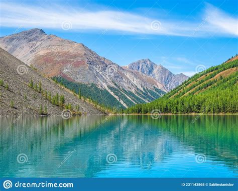 Colorful Landscape With Clear Mountain Lake In Forest Among Fir Trees