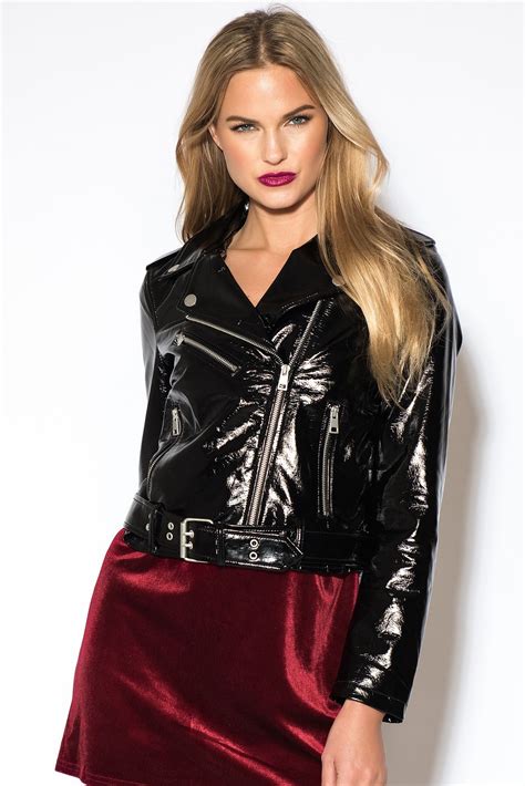 the patent pu jacket by rebecca stella features long sleeves a zipper closure and a buckle at