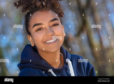 Outdoor Portrait Of Beautiful Happy Mixed Race Biracial African American Girl Teenager Female