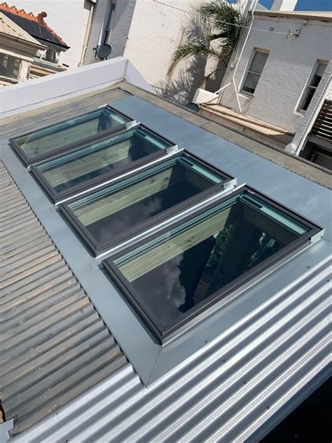 What types of skylights should you choose? Velux Skylights Installed into Corrugated Roof | Middle ...