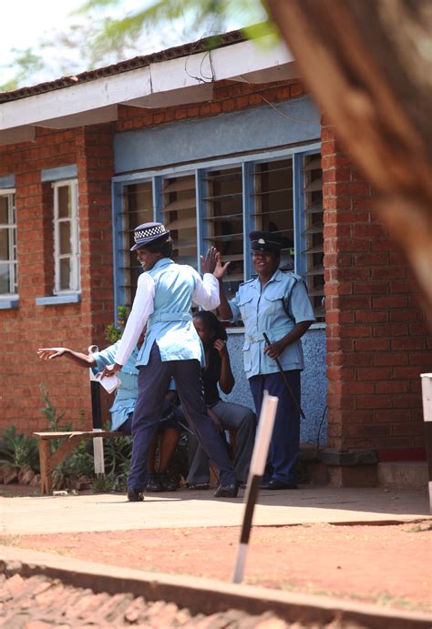 Female Police Officers Sharing A Moment At Kanengo Victim Support Unit